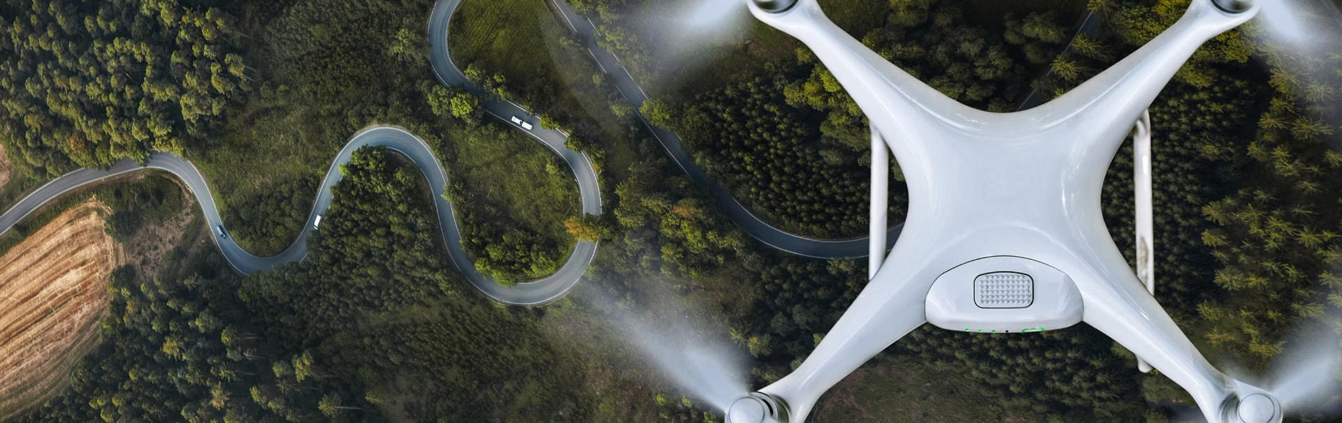 Drone flying above a winding road
