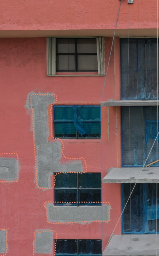 AI defect detection annotations on a building facade